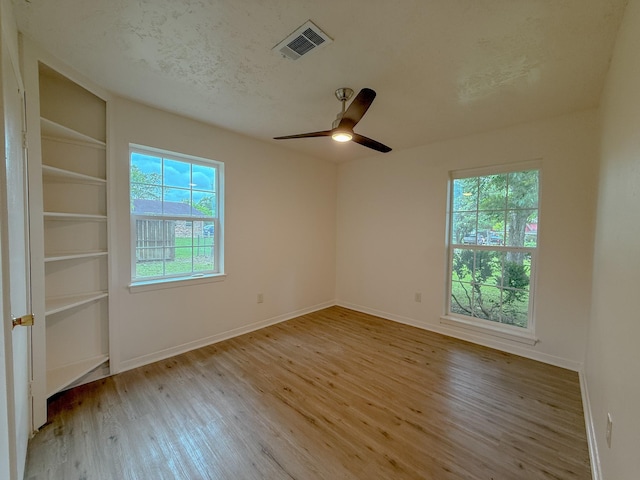 20 Woods Ln, Coldspring, TX 77331 - empty room featuring wood finished floors and a ceiling fan