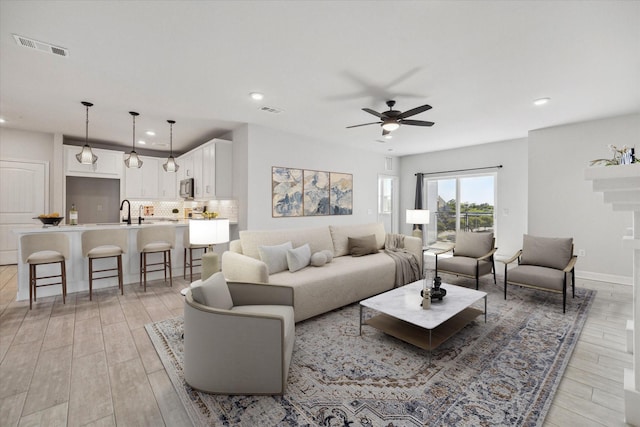 6804 Westview Dr Unit 1407, Houston, TX 77055 - living room with recessed lighting, light wood finished floors, and ceiling fan
