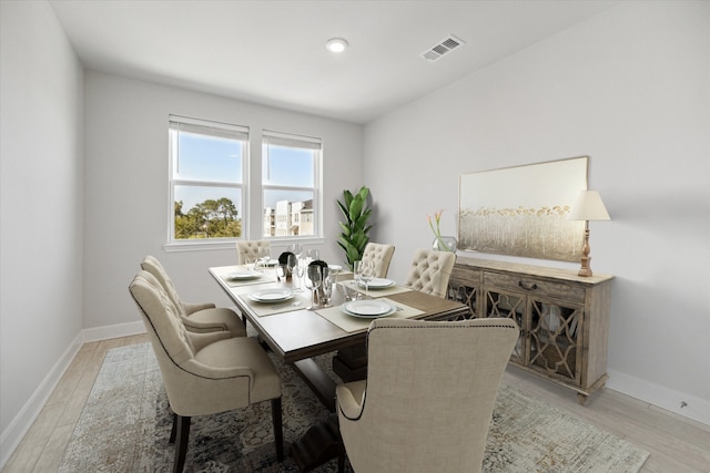 6804 Westview Dr Unit 1407, Houston, TX 77055 - dining area featuring baseboards and light wood finished floors