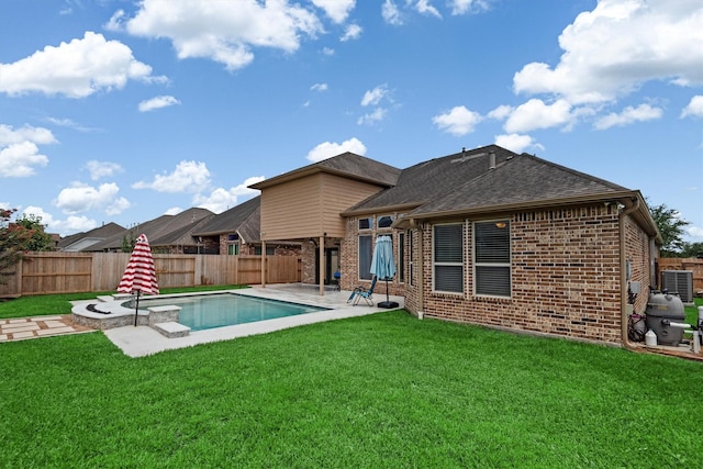 1512 Preserve Ln, Pearland, TX 77089 - rear view of property featuring brick siding, a fenced backyard, and a patio area