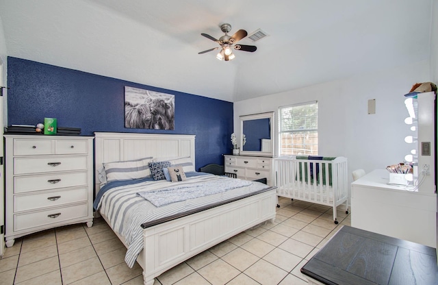 5107 Beaverhill Dr, Houston, TX 77084 - bedroom featuring light tile patterned floors, ceiling fan, and lofted ceiling