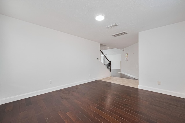 12230 Southmeadow Dr, Stafford, TX 77477 - unfurnished living room with stairs and wood finished floors