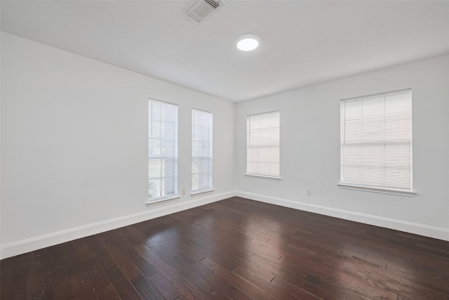 12230 Southmeadow Dr, Stafford, TX 77477 - spare room with baseboards and dark wood-style floors