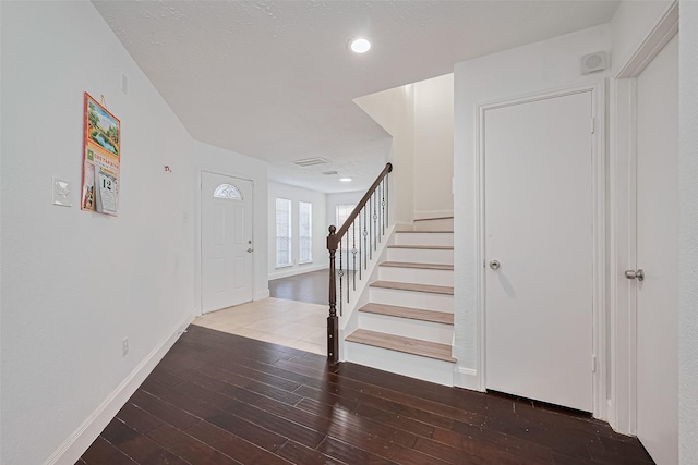 12230 Southmeadow Dr, Stafford, TX 77477 - foyer featuring stairs, wood-type flooring, and recessed lighting