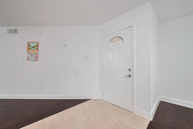 12230 Southmeadow Dr, Stafford, TX 77477 - foyer entrance featuring baseboards and light tile patterned floors