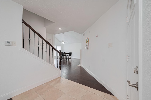 12230 Southmeadow Dr, Stafford, TX 77477 - entrance foyer with tile patterned flooring, stairs, ceiling fan, recessed lighting, and a textured ceiling