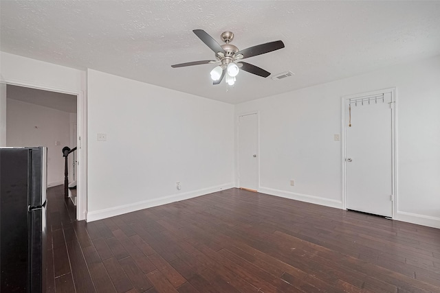 12230 Southmeadow Dr, Stafford, TX 77477 - spare room featuring dark wood-style floors and ceiling fan