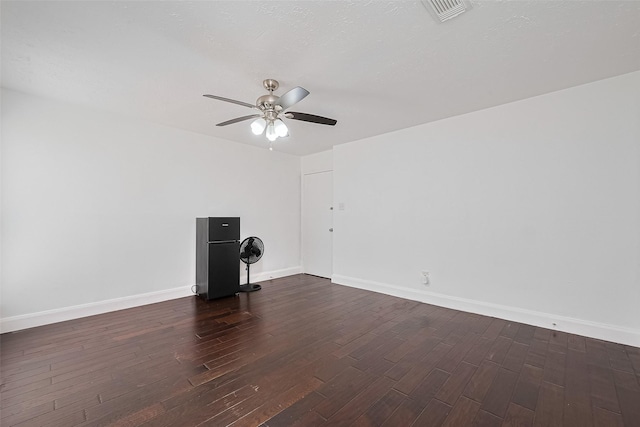 12230 Southmeadow Dr, Stafford, TX 77477 - spare room with a ceiling fan and dark wood-style flooring