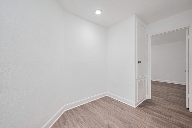 12230 Southmeadow Dr, Stafford, TX 77477 - empty room with wood finished floors and baseboards
