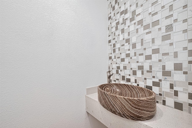 12230 Southmeadow Dr, Stafford, TX 77477 - bathroom view of a textured wall and backsplash