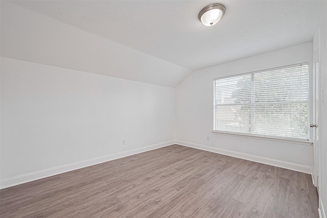 12230 Southmeadow Dr, Stafford, TX 77477 - bonus room with lofted ceiling and wood finished floors