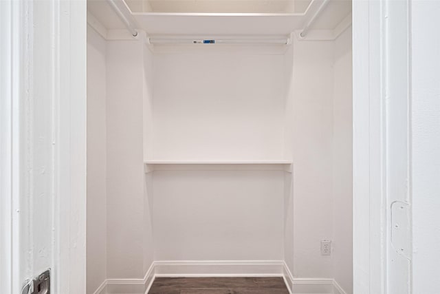 12230 Southmeadow Dr, Stafford, TX 77477 - spacious closet featuring dark wood-style floors