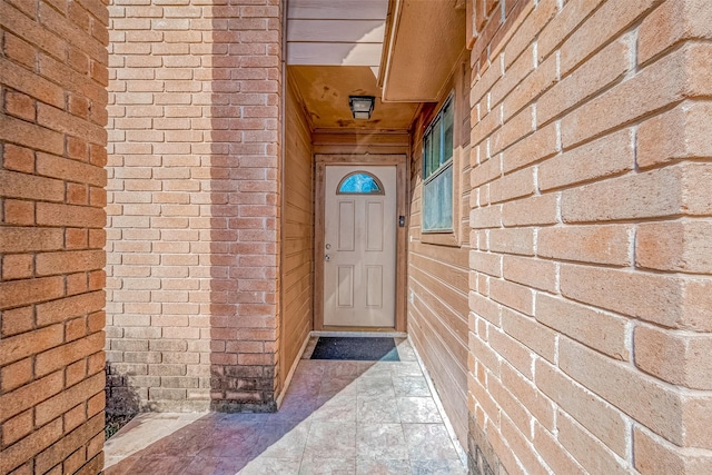 12230 Southmeadow Dr, Stafford, TX 77477 - doorway to property featuring brick siding