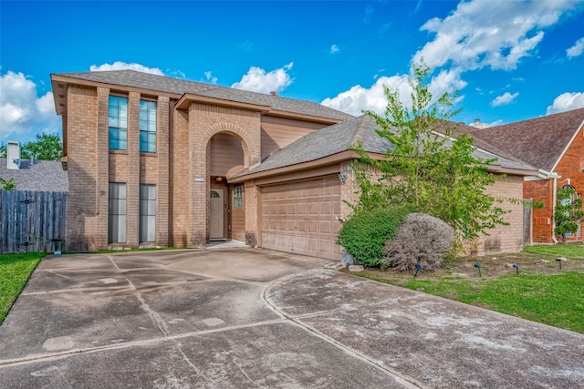 12230 Southmeadow Dr, Stafford, TX 77477 - view of front of property with brick siding, driveway, a garage, and roof with shingles