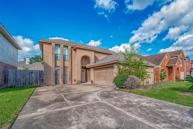 12230 Southmeadow Dr, Stafford, TX 77477 - traditional-style house featuring brick siding, an attached garage, and driveway
