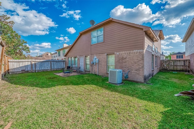 12230 Southmeadow Dr, Stafford, TX 77477 - back of property featuring brick siding, a patio area, and a fenced backyard