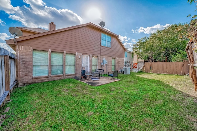 12230 Southmeadow Dr, Stafford, TX 77477 - back of property featuring brick siding, a fenced backyard, a patio, and a chimney