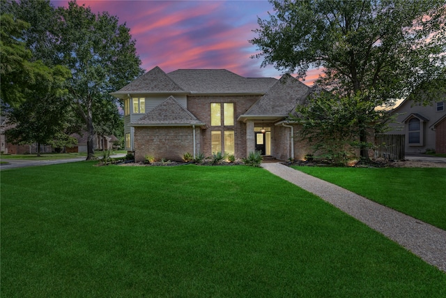 12414 Laneview Dr, Houston, TX 77070 - view of front facade featuring a front lawn, brick siding, and roof with shingles