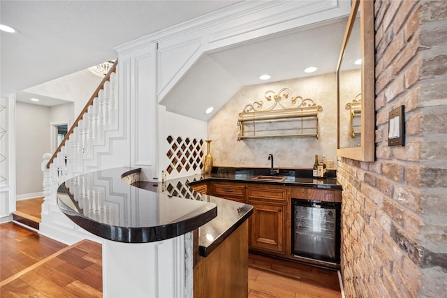 12414 Laneview Dr, Houston, TX 77070 - indoor wet bar with beverage cooler, hardwood / wood-style flooring, stairs, and recessed lighting