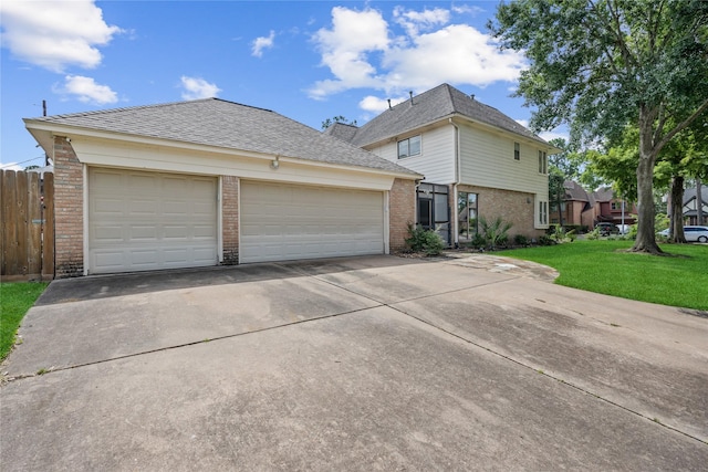 12414 Laneview Dr, Houston, TX 77070 - traditional-style home featuring brick siding, concrete driveway, an attached garage, and roof with shingles