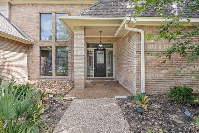 12414 Laneview Dr, Houston, TX 77070 - doorway to property featuring brick siding and a shingled roof