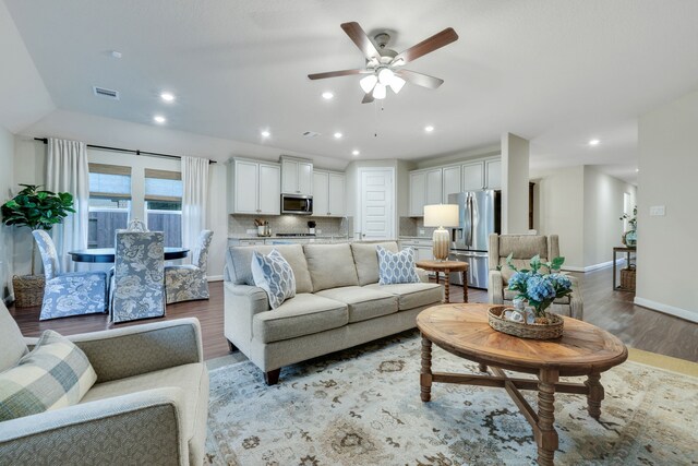 21310 Baldovin Way, Tomball, TX 77375 - living area featuring light wood-style floors, a ceiling fan, and recessed lighting