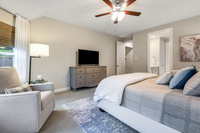 21310 Baldovin Way, Tomball, TX 77375 - bedroom with light carpet, a ceiling fan, vaulted ceiling, and connected bathroom