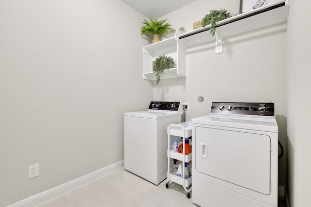 21310 Baldovin Way, Tomball, TX 77375 - laundry room featuring separate washer and dryer and light tile patterned floors