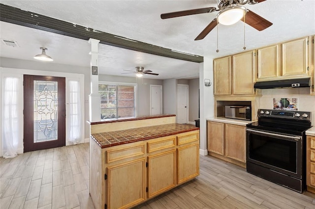 3520 Mattye Maye Dr, Pasadena, TX 77503 - kitchen featuring black range with electric cooktop, under cabinet range hood, a ceiling fan, light wood finished floors, and light brown cabinets