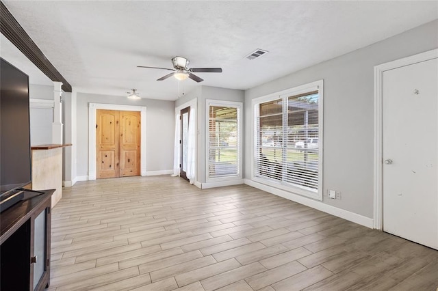 3520 Mattye Maye Dr, Pasadena, TX 77503 - unfurnished living room featuring a ceiling fan and light wood-type flooring