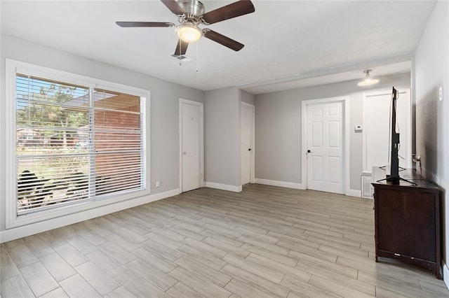 3520 Mattye Maye Dr, Pasadena, TX 77503 - unfurnished living room with a ceiling fan and light wood-style flooring