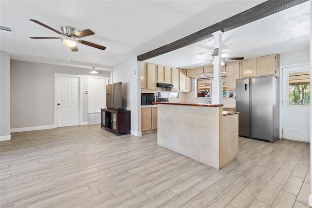 3520 Mattye Maye Dr, Pasadena, TX 77503 - kitchen featuring freestanding refrigerator, a ceiling fan, light brown cabinets, under cabinet range hood, and light wood-style floors