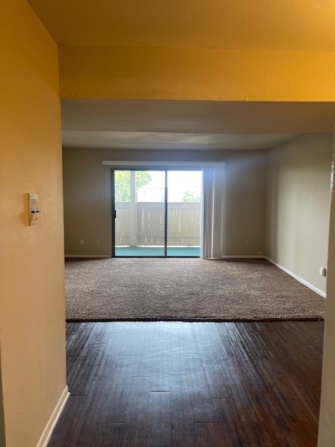 8515 Hearth Dr Unit 36, Houston, TX 77054 - empty room featuring baseboards and wood finished floors