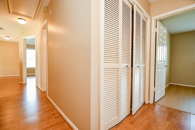 11707 Turtle Lake Dr, Houston, TX 77064 - hallway with attic access and light wood-style floors