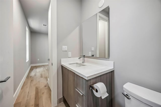 1111 W 21st St, Houston, TX 77008 - half bath featuring vanity and wood finished floors
