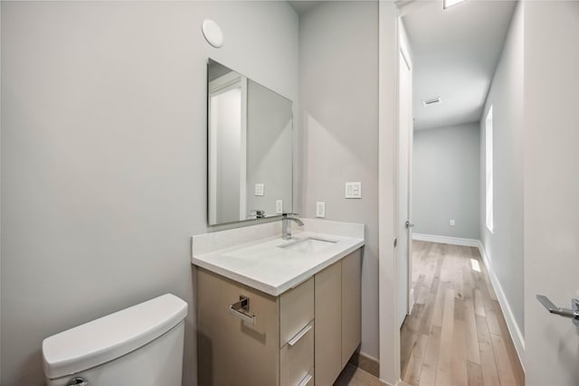 1111 W 21st St, Houston, TX 77008 - half bath featuring vanity and wood finished floors