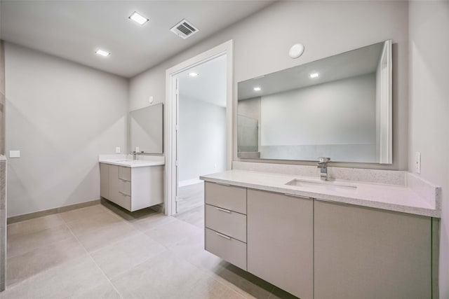 1111 W 21st St, Houston, TX 77008 - full bath featuring two vanities, tile patterned flooring, and recessed lighting
