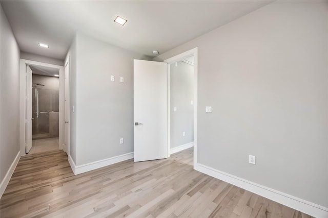 1111 W 21st St, Houston, TX 77008 - unfurnished bedroom with light wood-type flooring