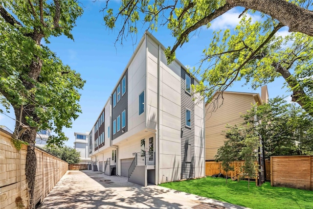 1111 W 21st St, Houston, TX 77008 - view of property with concrete driveway and a garage