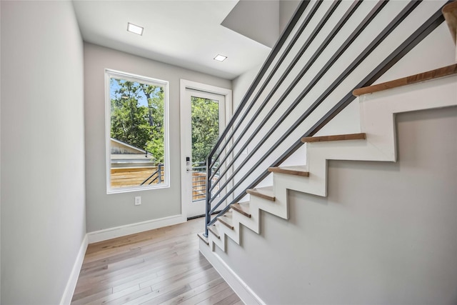 1111 W 21st St, Houston, TX 77008 - staircase featuring baseboards and wood finished floors