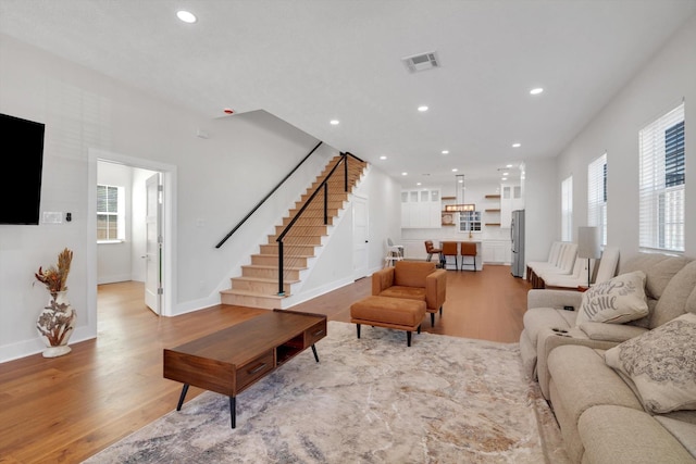 630 S Railroad Ave, Shepherd, TX 77371 - living room with wood finished floors, stairway, and recessed lighting