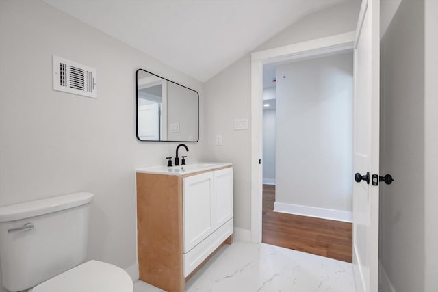 630 S Railroad Ave, Shepherd, TX 77371 - bathroom with vaulted ceiling, vanity, and marble look tile flooring