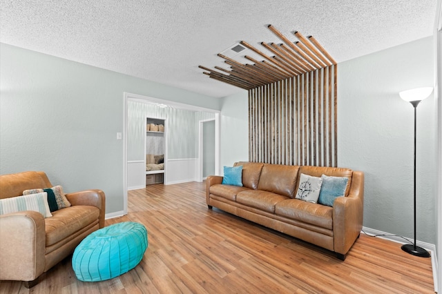 2014 17th St N, Texas City, TX 77590 - living room with a textured ceiling and wood finished floors