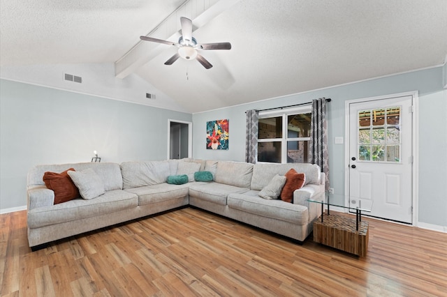 2014 17th St N, Texas City, TX 77590 - living area featuring light wood-style flooring, a ceiling fan, and a textured ceiling