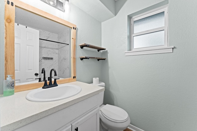 2014 17th St N, Texas City, TX 77590 - bathroom featuring a shower, vanity, and a textured wall