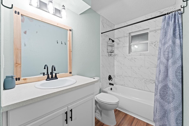 2014 17th St N, Texas City, TX 77590 - full bath featuring vanity, shower / tub combo, wood finished floors, and a textured ceiling