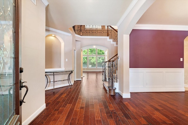 15602 Shining Brook Ct, Houston, TX 77044 - entryway featuring arched walkways, crown molding, stairway, and hardwood / wood-style flooring