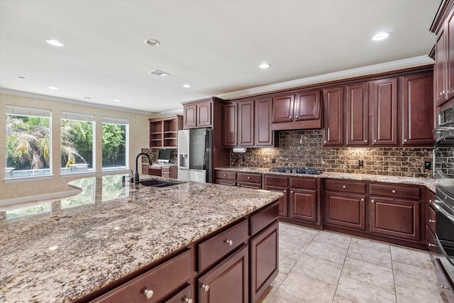 15602 Shining Brook Ct, Houston, TX 77044 - kitchen featuring stainless steel refrigerator with ice dispenser, ornamental molding, decorative backsplash, black gas cooktop, and light stone counters