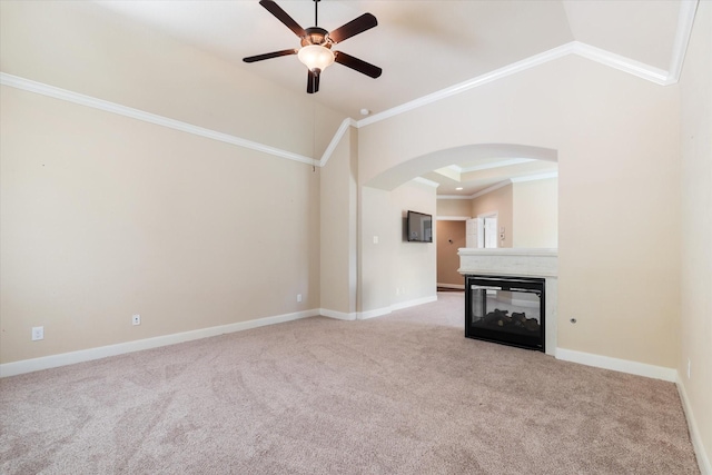 15602 Shining Brook Ct, Houston, TX 77044 - unfurnished living room with arched walkways, a ceiling fan, crown molding, carpet floors, and vaulted ceiling