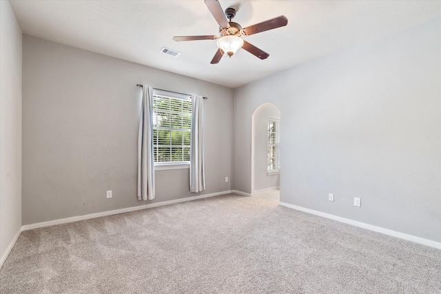 15602 Shining Brook Ct, Houston, TX 77044 - empty room with arched walkways, carpet, and ceiling fan